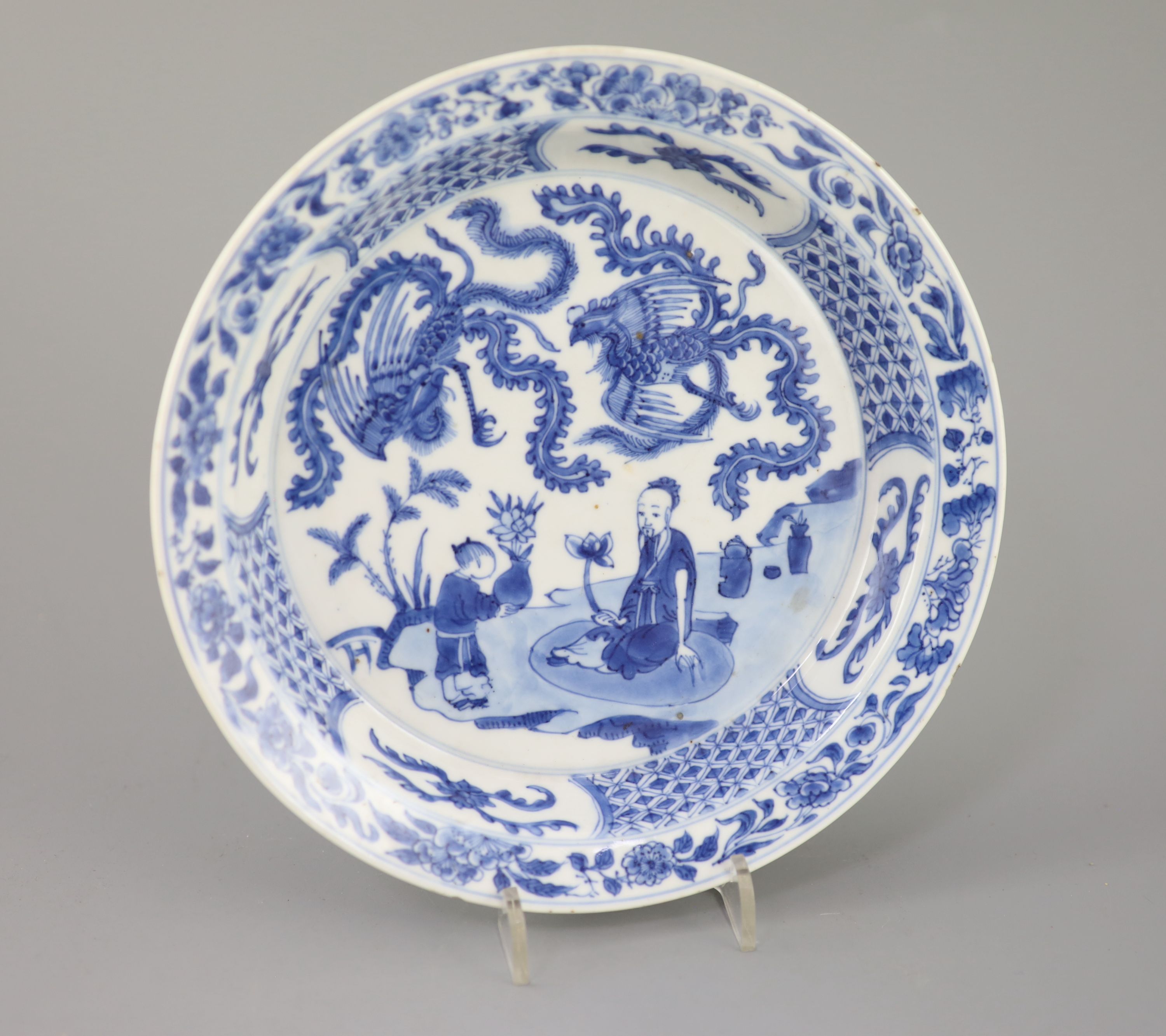A Chinese blue and white sage and phoenix dish, Kangxi period, 20.8cm diameter